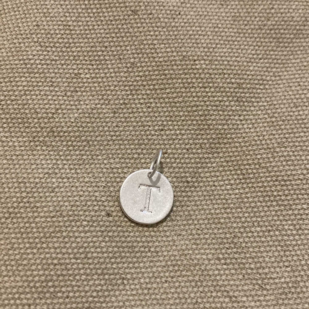 Sterling silver charm with initial ‘T’